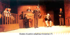 Scales of justice weighing innocence (?) - Witness for the defence (Deutsches Theater Toronto)