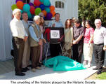 The unveiling of the historic plaque by the Historic Society