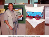Herbert Gross and a model of the Conestoga Wagon