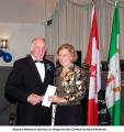 Monika Matthaes receives a cheque for the German School Kitchener