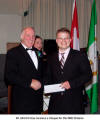Dr. Ulrich Frisse receives a cheque for the DKK Ontario