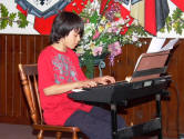 Cameron Miemiec plays the keyboard