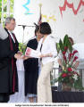 Judge Sarnis Assadovrian hands out certificates